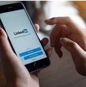 man checking linkedin app