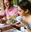 woman eating mexican tacos