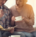 senior couple checking documents at tea