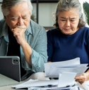 senior couple calculating financial billing