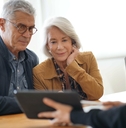 senior couple remodeling ideas on tablet