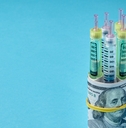 syringe pens wrapped in dollar bills