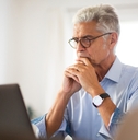 older businessman sitting in office