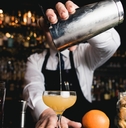 bartender pouring cocktail