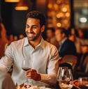 happy friends eating dinner in restaurant