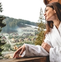 beautiful woman exploring landscape from terrace
