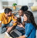 Three people considering credit card options