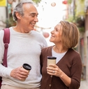 walking with backpack drinking coffee