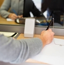 A customer filling out an application at a bank. 