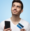 man holding smartphone and credit card
