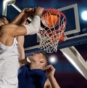 basketball players shooting goal