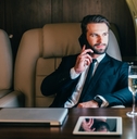 businessman flying on his private jet