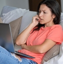 confused woman using laptop