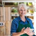 senior shopping assistant using tablet