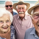 senior friends posing at beach vacation