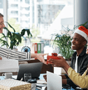 People getting holiday gifts from a boss at the office