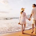 mature couple walking on the beach