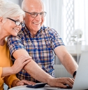 senior couple checking bills