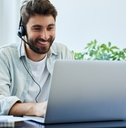 man with headset telecommuting