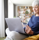 senior woman using credit card