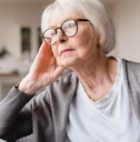 grandmother sitting on the sofa couch