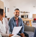 mature couple consulting female finance advisor