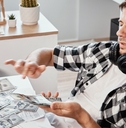 man counts dollar banknotes