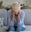 senior woman stressed while working