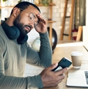 african freelancer with headache