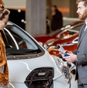 sales manager showing electric car