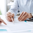 businessman discussing contract with female client
