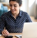 millennial indian woman paying bills