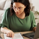 woman preparing budget using laptop