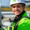 happy male electrician fixing airplane turbines