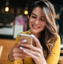 Smiling woman looking at phone