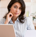 woman using laptop at home