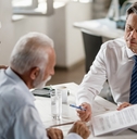 senior couple consulting bank manager