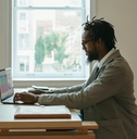 african american businessman using laptop
