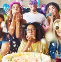multi ethnic goofy friends celebrating birthday