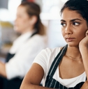 female waitress unhappy working at cafe