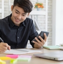 young man using the calculator