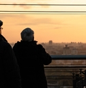 elderly couple watching sunset
