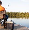 man fishing on a lake