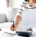 woman calculating annual tax 