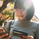 Smiling woman looking at her phone