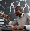 male brokers reviewing stocks together