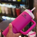 customer holding pink stanley tumbler