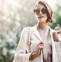 woman holding shopping bags in street