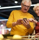 senior couple grocery shopping