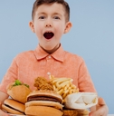 excited little boy with foods